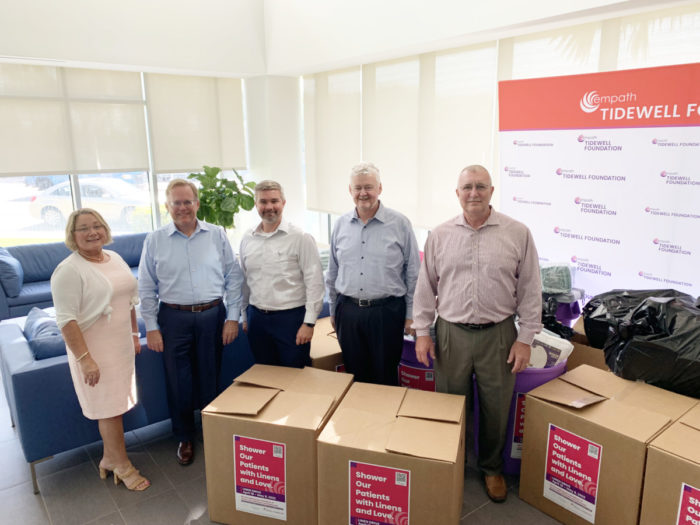 Debbie Mason with the Dignity Memorial team with boxes of linens from the 2022 linen drive