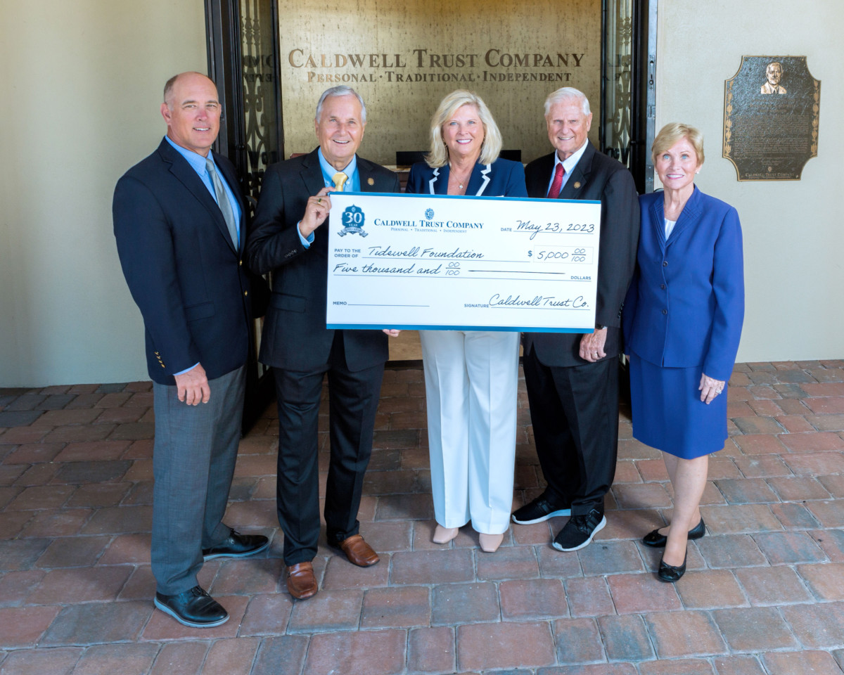caldwell trust presenting Tidewell Foundation with a check