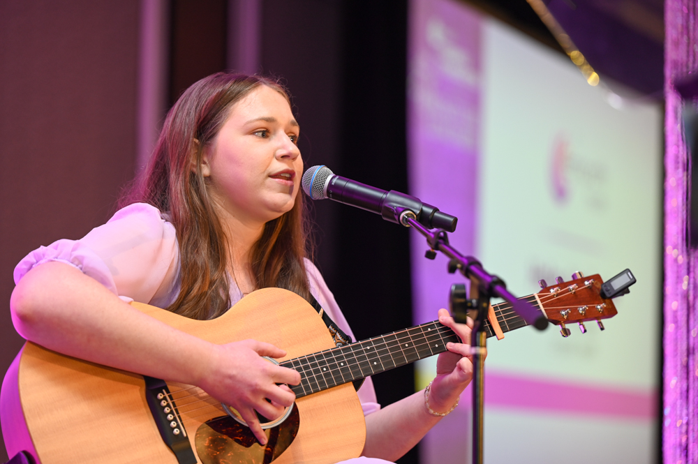 Music Therapist playing guitar and singing